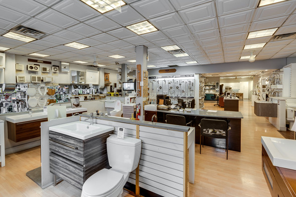 Consumer Supply showroom featuring toilets and bathroom vanities