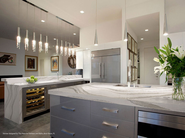 Modern white and grey kitchen with quartz countertops
