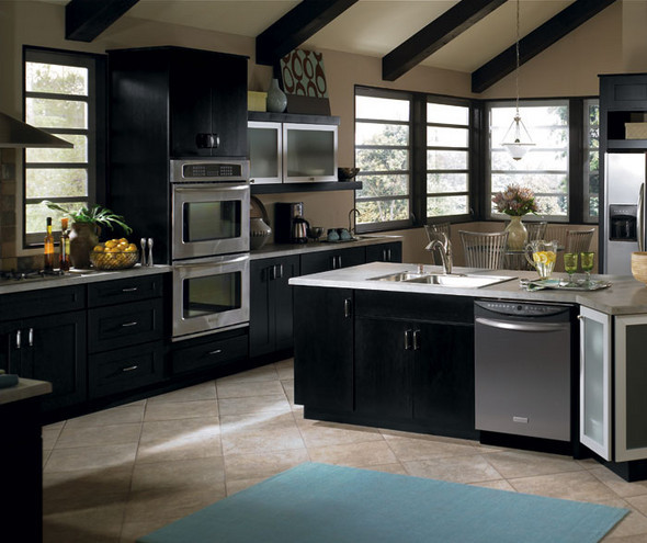 Black kitchen cabinets with stainless steel appliances