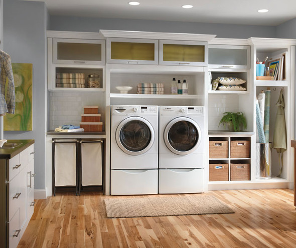 Casual white cabinets with frosted glass in a laundry room
