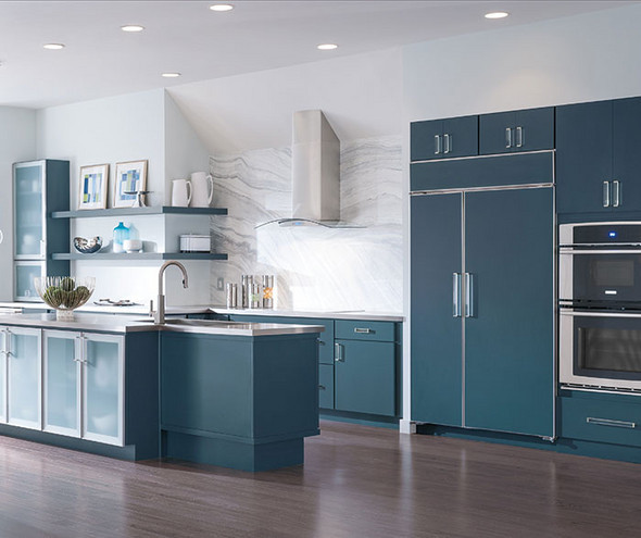 Modern kitchen with blue cabinetry and white marble countertops
