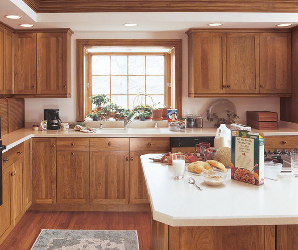 Rustic wooden cabinets with white countertops