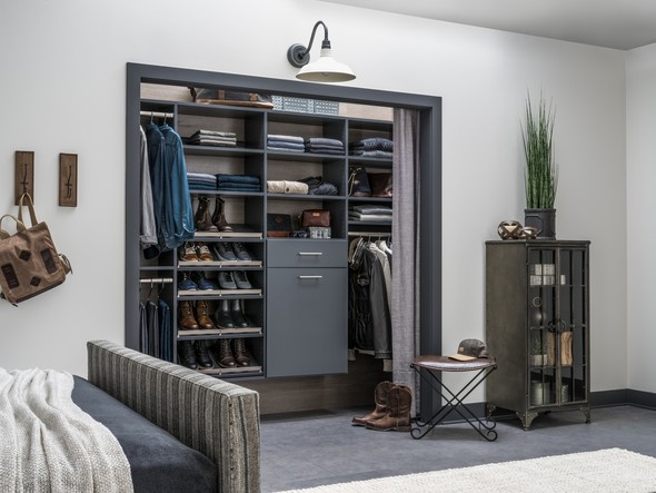 Dark modern closet with shelving and shoe racks
