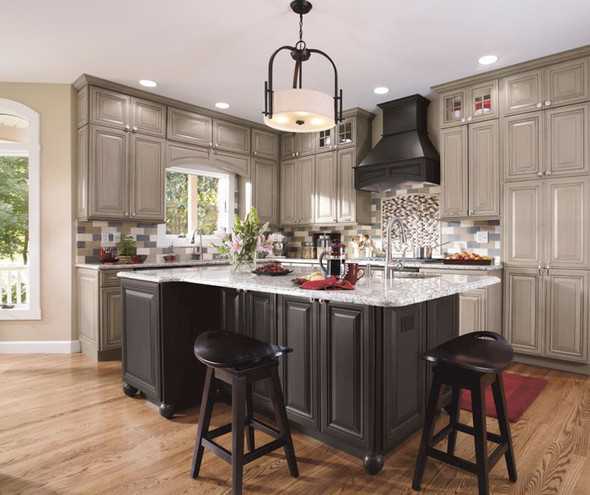 Open kitchen with a black island and grey cabinetry