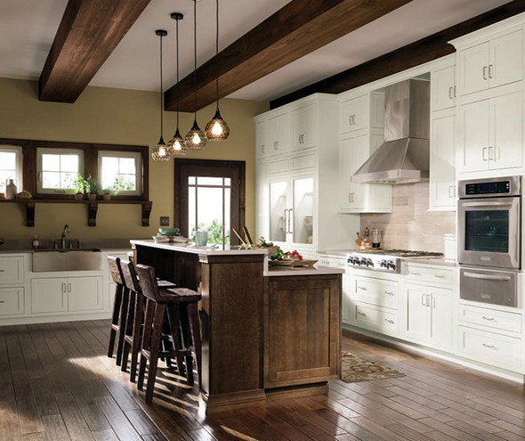 Kitchen with rustic white cabinets and a darker wooden island
