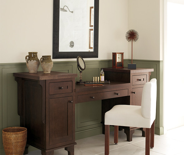 Traditional wooden vanity with a white chair